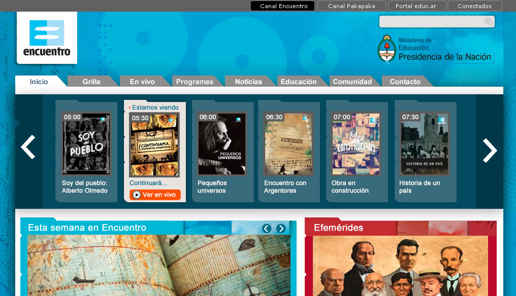 Captura de pantalla de la página de inicio de Canal Encuentro, se destacan el logo sobre un fondo celeste y un carrusel de programas